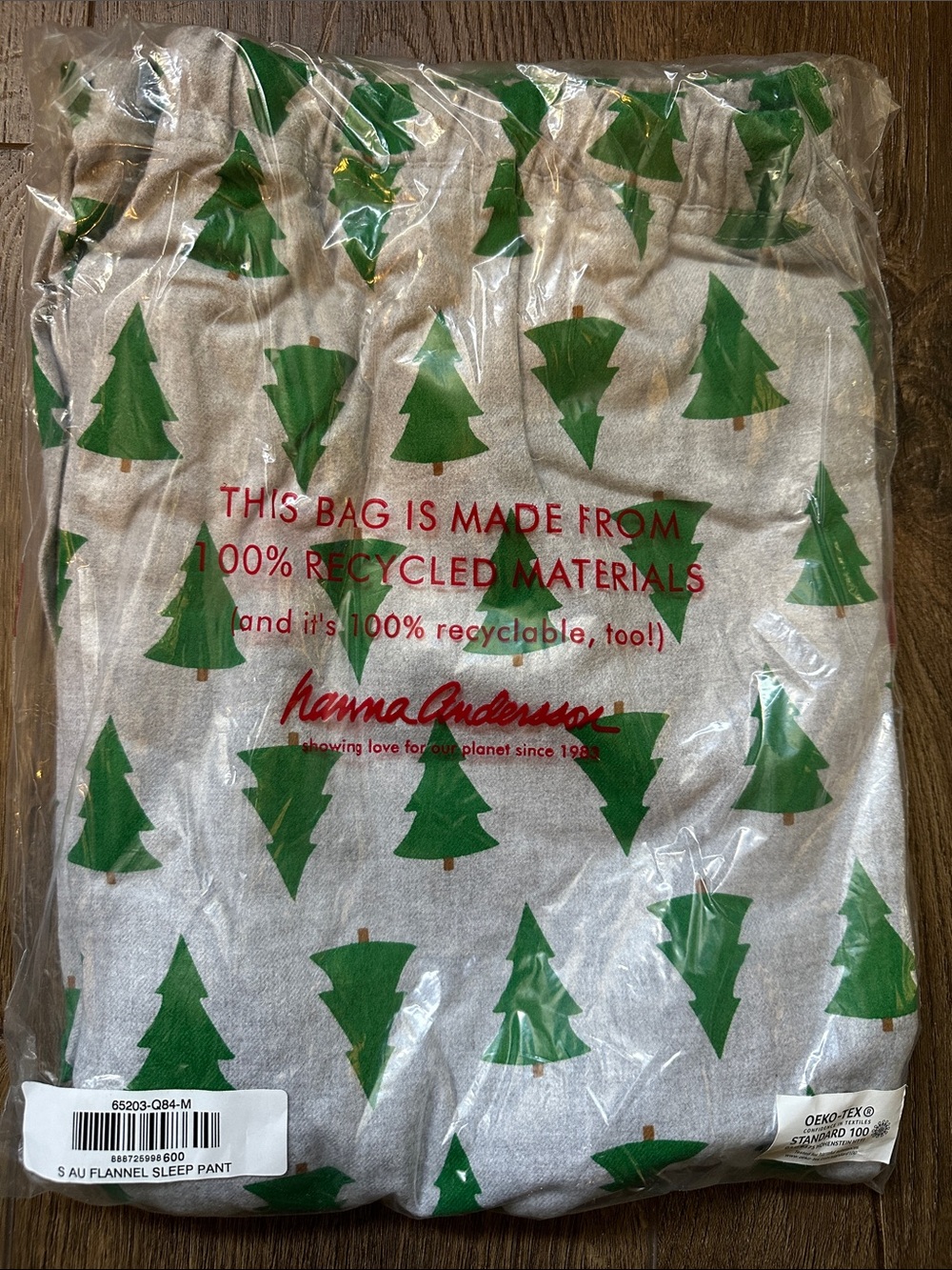 Hanna Andersson Green Tree Flannel Sleep Pants on Light Gray